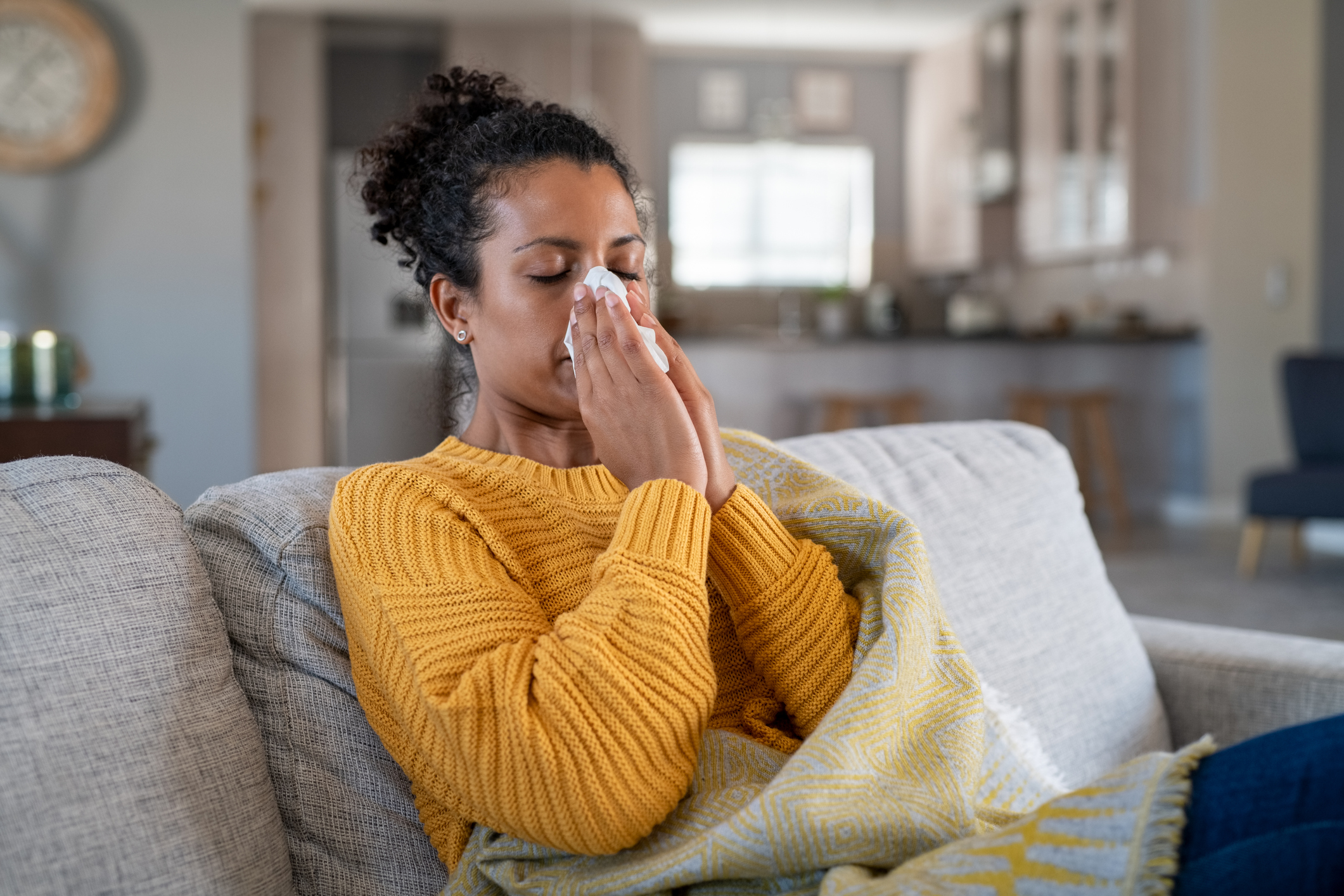 Cold sick woman blowing nose