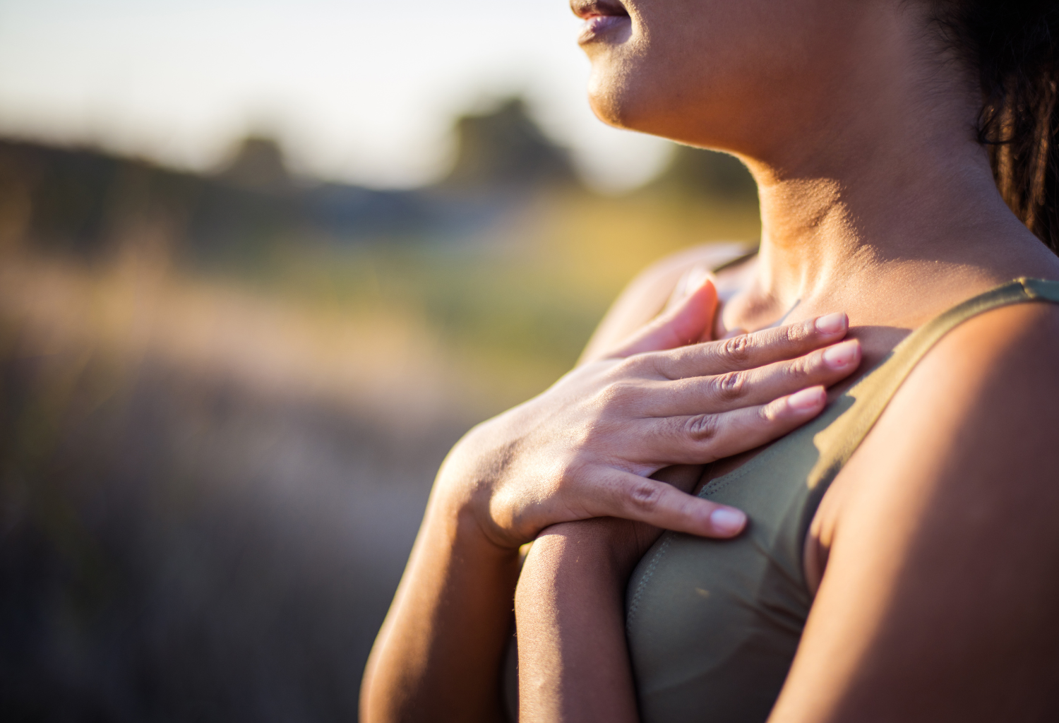 woman breathing comfortably outside in the summertime at sunset by seeing Dr. Jackie Garrett at Agape Allergy and Immunology